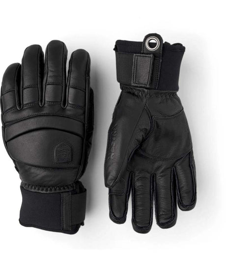 FallLine-Pair of black leather gloves with black cuffs on a white background