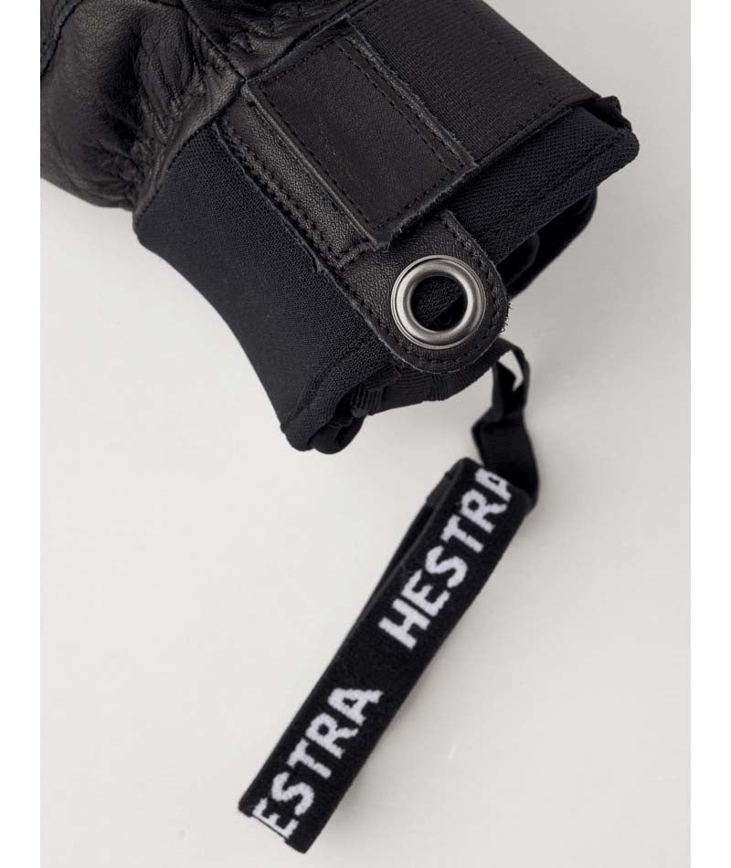 FallLine-Pair of black leather gloves with black cuffs on a white background