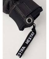 FallLine-Pair of black leather gloves with black cuffs on a white background
