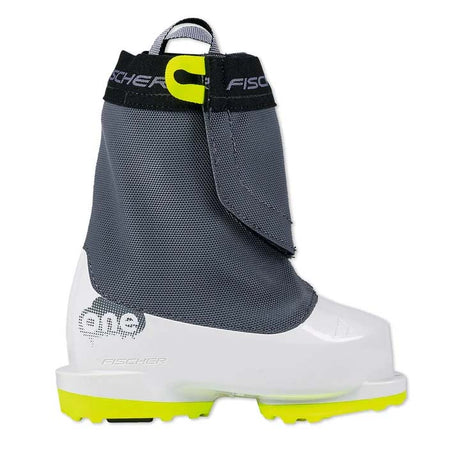 FischerOne- A Fischer ski boot shown in profile against a white background, featuring a dark gray mesh upper, a white plastic toe box, and neon yellow accents on the strap, pull tab, and outsole.