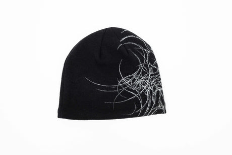 GeneralSkully- A black knit beanie hat featuring a white abstract line-art graphic on the left side and a small yellow 'public' logo on the lower right edge, shown against a plain white background.
