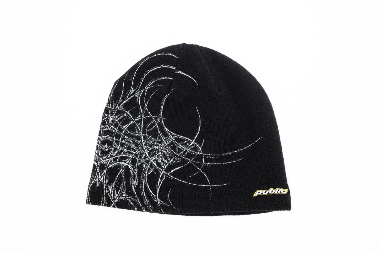 GeneralSkully- A black knit beanie hat featuring a white abstract line-art graphic on the left side and a small yellow 'public' logo on the lower right edge, shown against a plain white background.