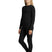 GirlsBaselayer-Person wearing a black long-sleeve top and leggings on a white background