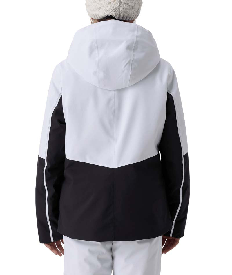 GirlsConquerJacket- Girl wearing a black and white ski jacket on a white background