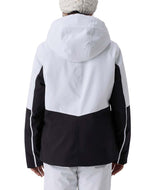 GirlsConquerJacket- Girl wearing a black and white ski jacket on a white background