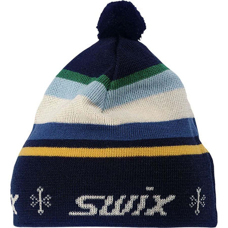 GundeBeanie-A knit pom-pom beanie hat with horizontal stripes in navy, blue, light blue, cream, green, and yellow, featuring a white knitted 'swix' logo and snowflake motifs on the folded cuff.