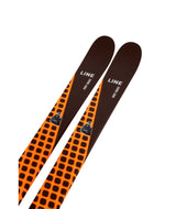 HoneyBadger- Orange and black skis with visible branding on a white background