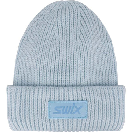 HorizonBeanie-A light blue ribbed knit beanie hat with a folded cuff and a square patch on the front featuring the 'swix' logo.