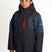 HydraBoysInsulatedJacket-A child wearing a Karbon ski jacket in dark gray and navy blue with a red zipper accent, paired with bright red pants, against a plain white studio background.