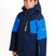 HydraBoysInsulatedJacket-A young boy wearing a Karbon ski jacket in navy blue and bright blue, with a yellow zipper and white brand logo on the chest, photographed against a plain white background.