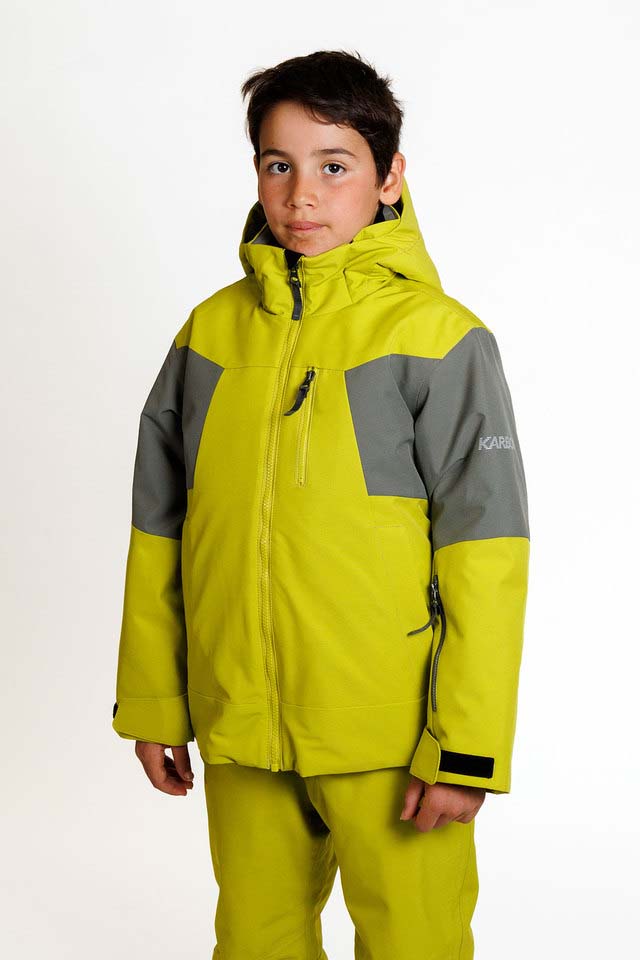 HydraBoysInsulatedJacket-A child wearing a bright yellow-green and gray ski jacket with matching pants, photographed against a plain light gray studio background.