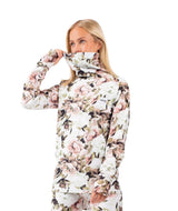 IcecoldTop- Woman wearing a floral printed high neck baselayer on a white background