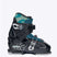 Indy2-A single ski boot shown in profile against a light gray background. The boot is primarily black with teal accents on the collar and tongue, and silver metal buckles and hardware.