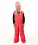 KidsHaileyBib- Child wearing pink snow bibs on a white background