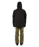 KnoxJacket-A man wearing a black snowboard jacket, black beanie with goggles, and gray gloves, standing against a solid white background.