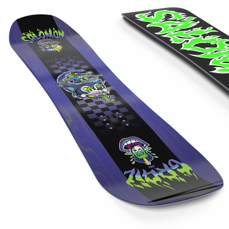 Grail- A Salomon Grail Kids snowboard featuring a vibrant design with green flame and dragon graphics on a black background, and a blue tip design.