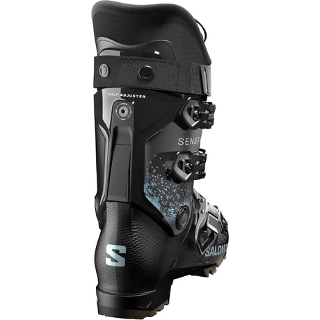 Sense 70- Salomon Sense 70 GW Kids Ski Boots in black with blue accents, featuring multiple buckles and the Salomon logo on the side.