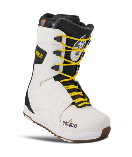 LashedFava- White snowboard boot with black accents and yellow laces on a white background
