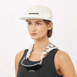 LogoFlatCap-Woman wearing a Salomon cap on a white background