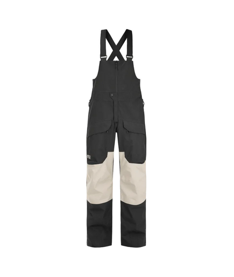 MAveningBibPant-Colorblock bib overalls in black and beige, featuring adjustable shoulder straps, a front button closure, and multiple utility pockets, shown against a plain white background.