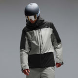 MCanopyProInsulatedJacket-A colorblock hooded jacket with a black upper section and sleeves, a light gray midsection, and a black lower section, featuring a full-zip front and a small white Oakley logo on the chest.