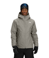 MCartoMonoTriclimateHoodedJacket-Person wearing a gray jacket with The North Face logo on a white background