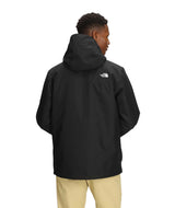 MCartoMonoTriclimateHoodedJacket-Person wearing a black jacket with a brand logo on the back, standing against a white background