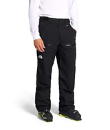MChakalPant- Man wearing black snow pants with The North Face logo on a white background