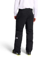 MChakalPant- Man wearing black snow pants with The North Face logo on a white background