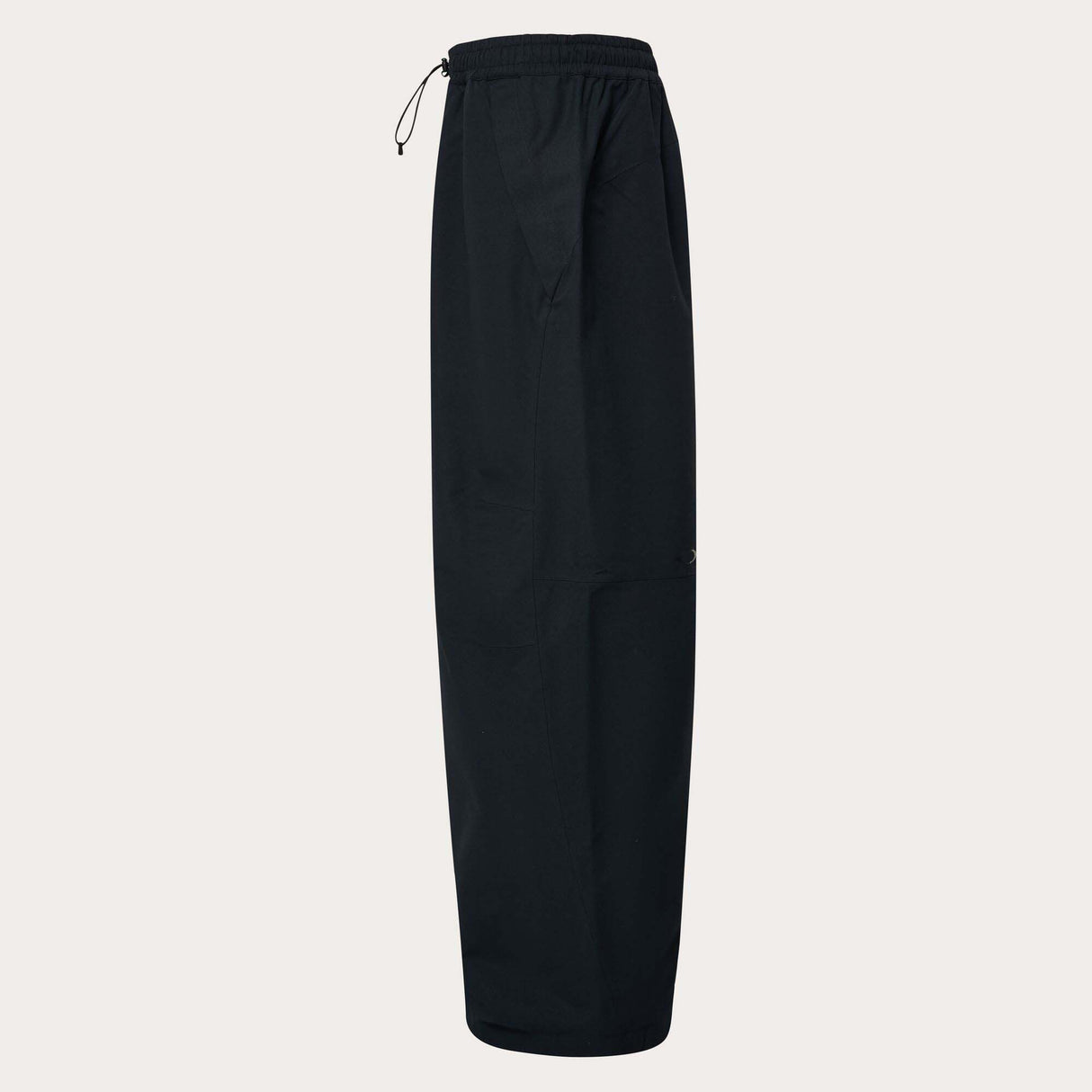 MChannelShellPant-Black wide-leg snow pants with an elastic drawstring waist and side pockets, shown on a light gray background.