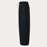 MChannelShellPant-Black wide-leg snow pants with an elastic drawstring waist and side pockets, shown on a light gray background.