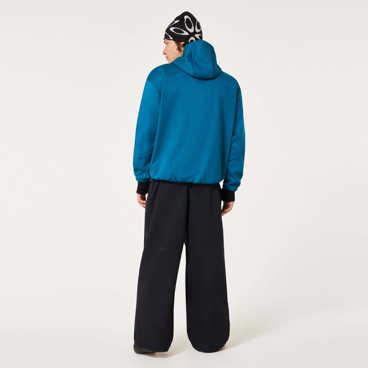 MChannelShellPant-Black wide-leg snow pants with an elastic drawstring waist and side pockets, shown on a light gray background.