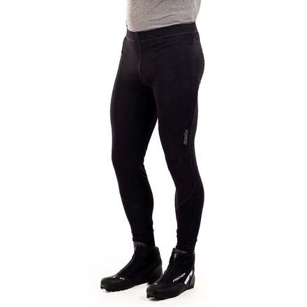 MDeldaSoftshellTight-Black full-length insulated leggings shown on a cropped lower-body mannequin or model, paired with black boots against a plain white background.