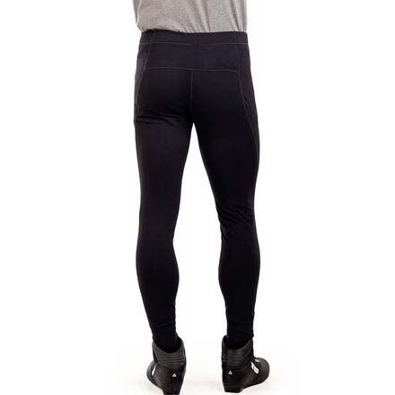 MDeldaSoftshellTight-Black full-length insulated leggings shown on a cropped lower-body mannequin or model, paired with black boots against a plain white background.
