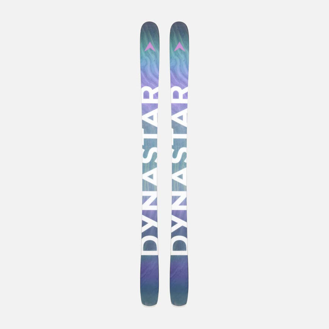 MFree94-A pair of Dynastar skis shown vertically against a light gray background, featuring a dark teal and purple marbled pattern with pink and white branding details.