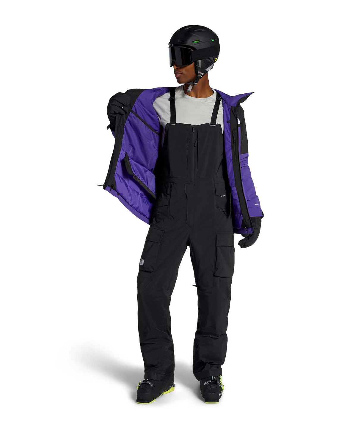 MFreedomBib-Person wearing a black snowsuit with a purple jacket on a white background