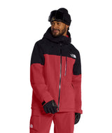 MFreedomInsulatedJacket-Person wearing a red and black North Face jacket on a white background