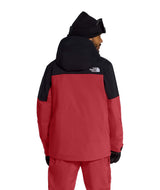 MFreedomInsulatedJacket- Person wearing a red and black jacket with a hood, standing against a white background.