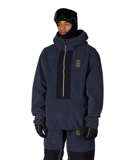 MGhost2.5LAnorak-Person wearing a dark blue winter jacket with a brand logo on a white background