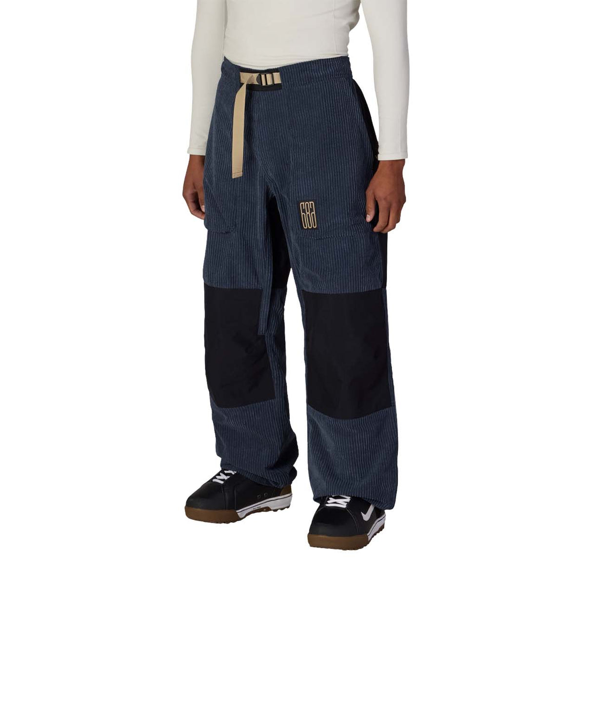 MGhost2.5LPant-Person wearing blue and black pants with beige accents on a white background