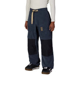 MGhost2.5LPant-Person wearing blue and black pants with beige accents on a white background