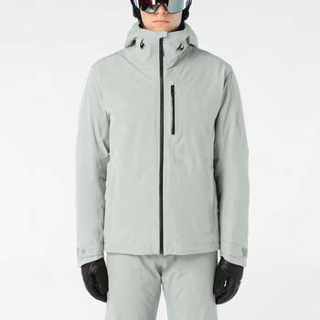 MHighlandInsulatedJacket-Person wearing a light gray ski jacket, pants, gloves, and helmet on a white background