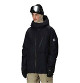 MHydraThermagraphJacket-A man wearing a black ski jacket with black zippers, black gloves, a cream neck gaiter, and a black beanie with goggles, photographed against a plain white background.