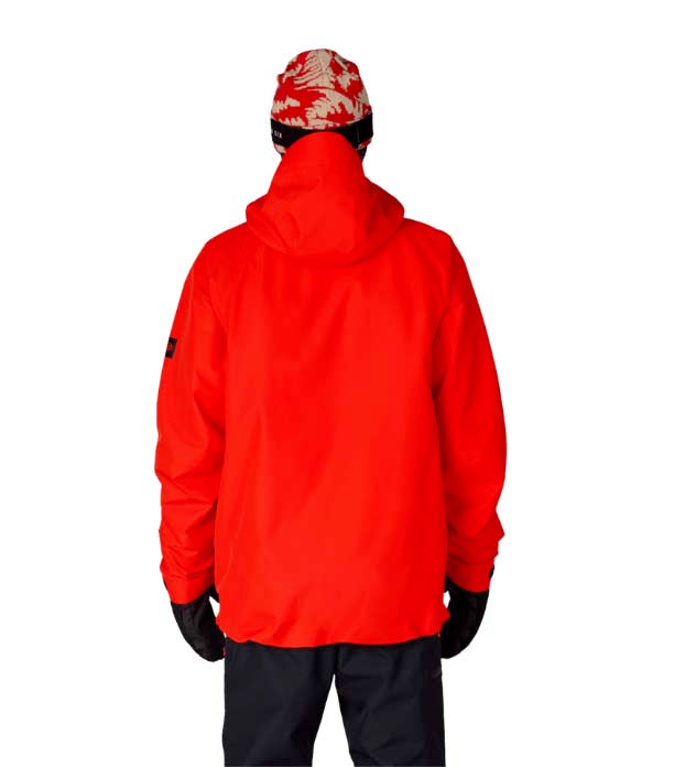 MHydraThermagraphJacket-A man wearing a bright red ski jacket with black zippers, black gloves, a black neck gaiter, and a red-and-black patterned bandana with goggles, photographed against a plain white background.