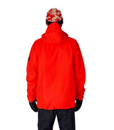 MHydraThermagraphJacket-A man wearing a bright red ski jacket with black zippers, black gloves, a black neck gaiter, and a red-and-black patterned bandana with goggles, photographed against a plain white background.