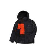 MHydraThermagraphJacket-A man wearing a black ski jacket with black zippers, black gloves, a cream neck gaiter, and a black beanie with goggles, photographed against a plain white background.