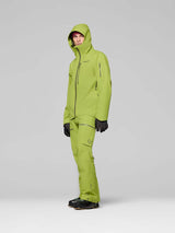 LofotenGore-TexJkt-Person wearing a green ski jacket on a gray background