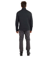MMerinoAeroGridFleece-A man wearing a dark charcoal gray quarter-zip long-sleeve performance pullover and dark gray pants, standing against a solid white background.
