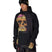 MMetallicaWaterproofHoody-Person wearing a black hoodie with a colorful skull design on a white background