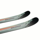 MNSTANCEPRO82-Two green and black Salomon skis on a white background